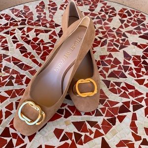 A pair of new suede 2” Stuart Weitzman shoes.